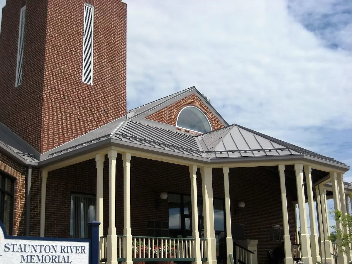 Skilled roofing craftsmen working on a residential roof in New Holland